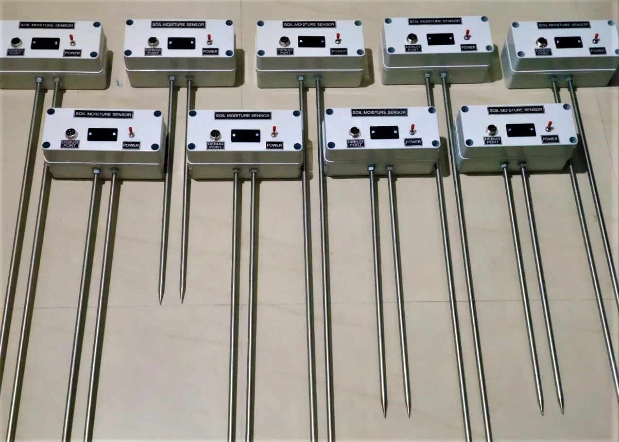 A batch of soil moisture sensor units laid out — each with a metal probe rod.